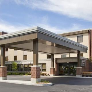 A modern hotel building with a prominent entrance.
