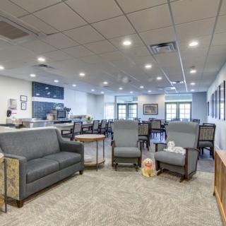 Spacious lobby area with comfortable seating and soft lighting.