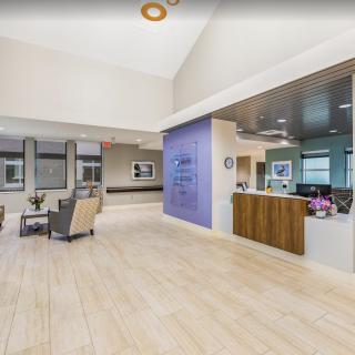 A modern reception and waiting area with comfortable seating and sleek design.