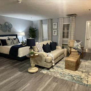 A cozy and stylish combined living room and bedroom area with modern decor.