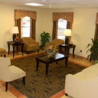 A cozy living room with comfortable seating and elegant decor.