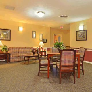 A cozy lobby with seating area and decor.