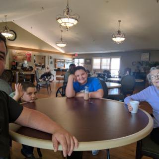 A joyful family gathering at a community center, sharing smiles and moments together.