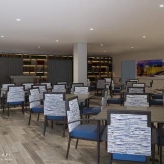 A modern and spacious dining area with neatly arranged tables and chairs.
