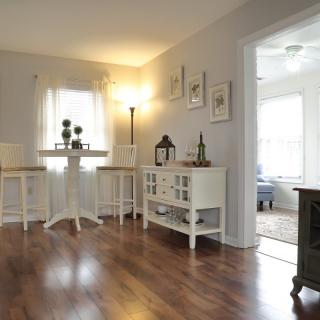 A cozy living room with elegant decor and hardwood flooring.