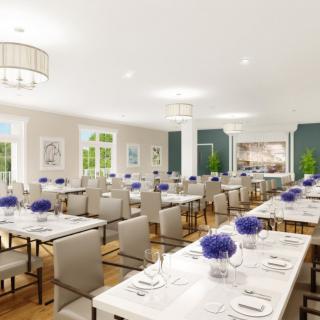 A beautifully arranged dining area with elegant decor and floral centerpieces.