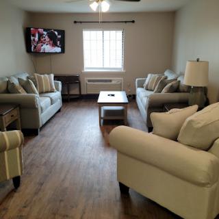 A cozy living room with comfortable seating and natural light.