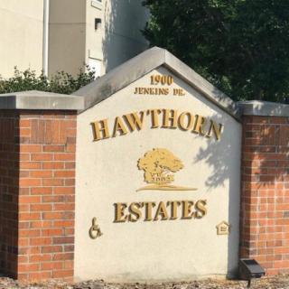 Stone and brick sign for Hawthorn Estates community.