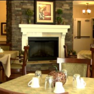 A cozy dining area featuring a fireplace and elegant decor.