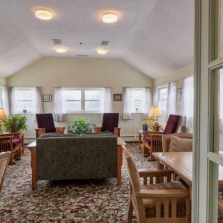 A cozy living room with comfortable seating and natural lighting.