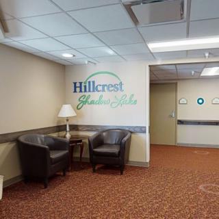 A lobby area with chairs and signage for Hillcrest Rehabilitation.