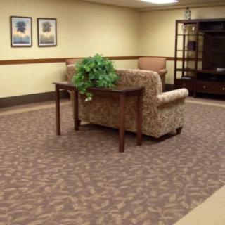A cozy living room with a sofa, table, and decorative elements.