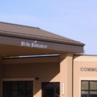 A commercial building entrance with signage on the facade.
