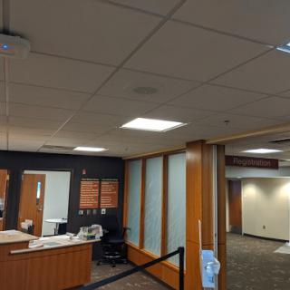 A view of a modern office reception area with contemporary design and lighting.
