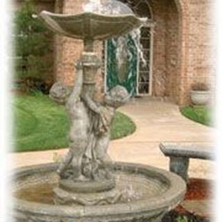 A decorative garden fountain with cherub sculptures.