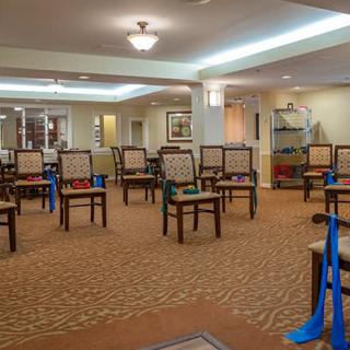 An empty meeting room arranged with chairs, ready for a conference or gathering.