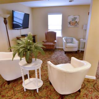 Cozy living room with comfortable seating and a television.