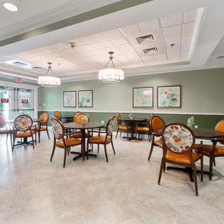 An empty dining area with elegant decor and lighting.