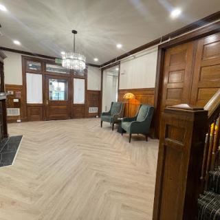 A beautifully designed lobby featuring elegant wood paneling and modern seating arrangements.