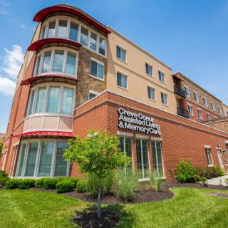 A modern commercial building with large windows and a sleek design.