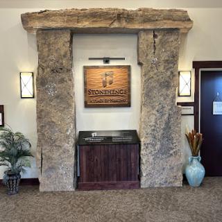 An inviting lobby area featuring a unique stone arch and modern decor.