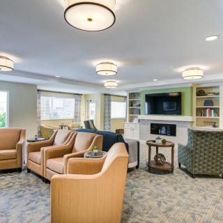 Spacious and inviting living room with modern furnishings and elegant lighting.