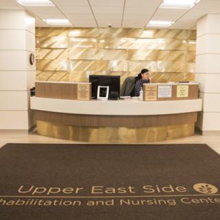 The reception area of Upper East Side Rehabilitation and Nursing Center, showcasing a modern design.
