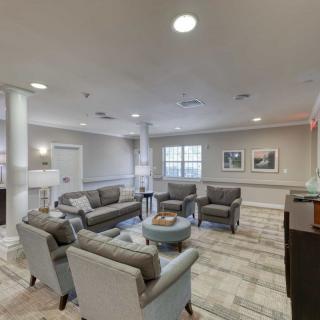 A cozy living room with modern furniture and soft lighting.