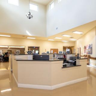 A spacious and well-lit reception area with modern furnishings.