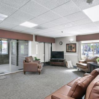 A cozy living room with comfortable seating and a television.