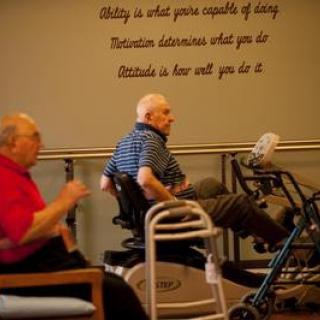 Seniors engaging in physical activity at a rehabilitation center, promoting health and wellness.