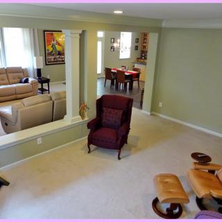 A spacious living area with comfortable seating and modern decor.