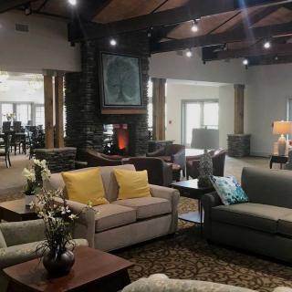 A spacious and modern living room with comfortable sofas and elegant decor.