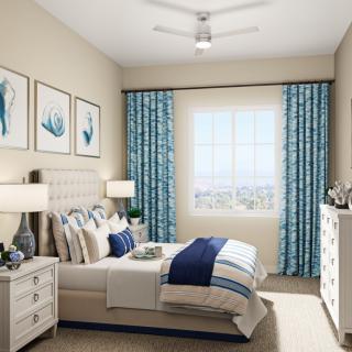 A modern bedroom featuring blue accents, stylish wall art, and coordinated decor.