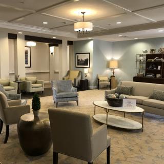 A well-furnished lobby with comfortable seating and elegant decor.