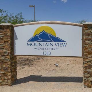 Entrance sign for Mountain View Care Center with a mountain logo.