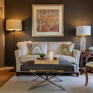 A stylish living room with a cozy sofa, modern coffee table, and elegant lighting.