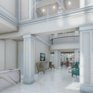 A modern and elegant lobby with marble floors and stylish furniture.
