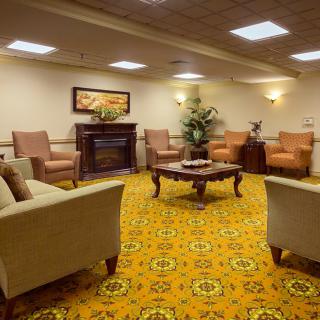 A cozy lobby area with comfortable seating and warm lighting.