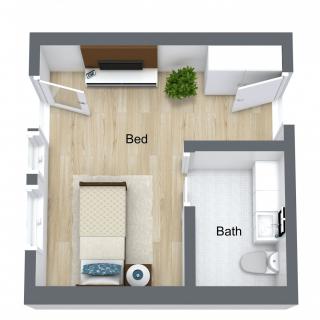 A floor plan of a compact studio apartment featuring a bedroom and bathroom.