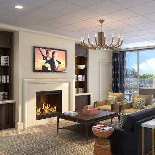 A modern living room with a cozy fireplace and stylish furniture.