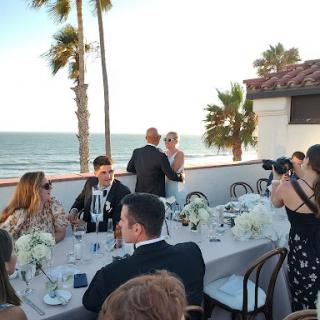 A beautiful outdoor wedding reception overlooking the beach.