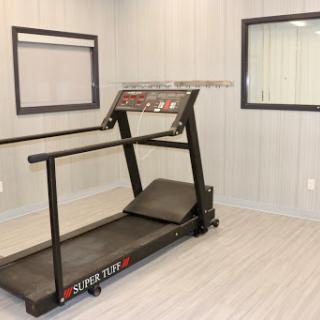 A treadmill ready for a workout session in a well-lit indoor space.