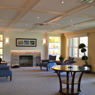 A spacious and elegantly decorated lobby area with comfortable seating and a fireplace.