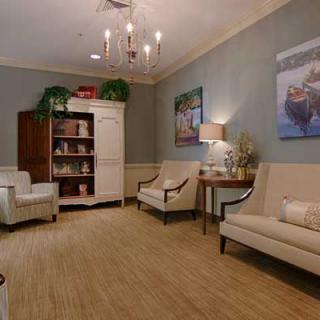 A cozy waiting room with comfortable seating and soft lighting.