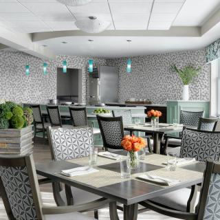 A modern dining area with elegant decor and neatly arranged tables.