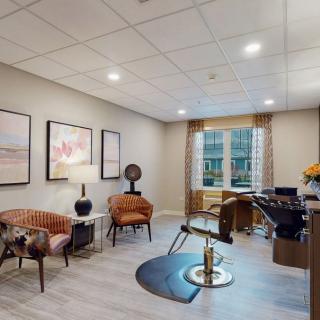 A modern office space featuring contemporary furniture and artwork.