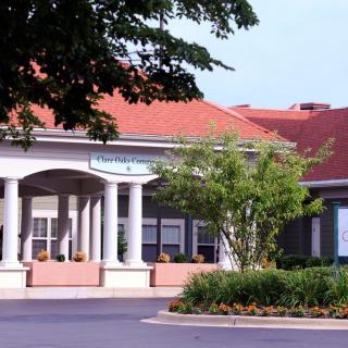 Entrance to a building surrounded by greenery.
