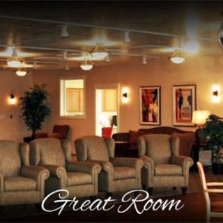 A cozy lounge area with comfortable seating and warm lighting.