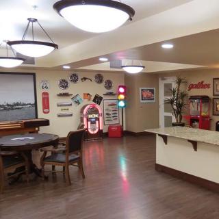 A retro-themed diner interior with a jukebox and vintage decor.